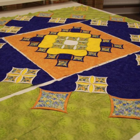 Sunny garden cathedral window quilt
