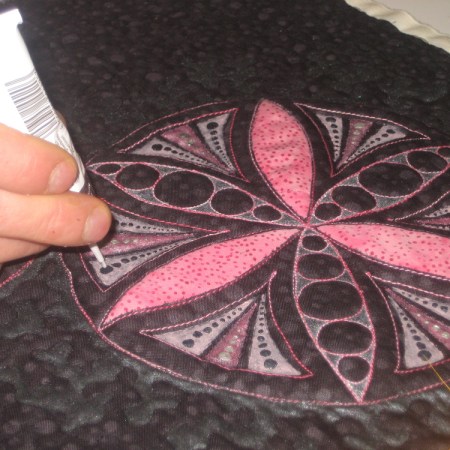 Pink and black wall hanging